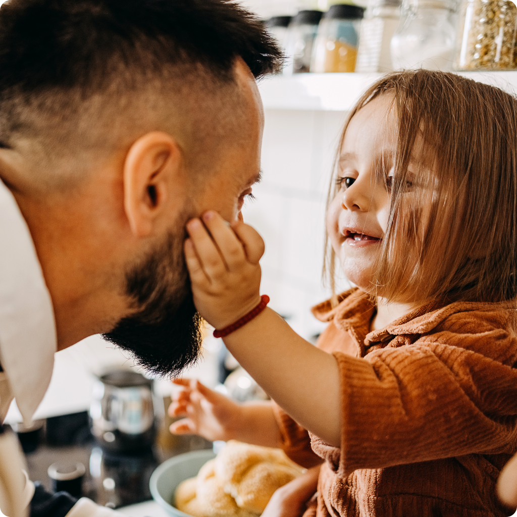 girl touching man's face